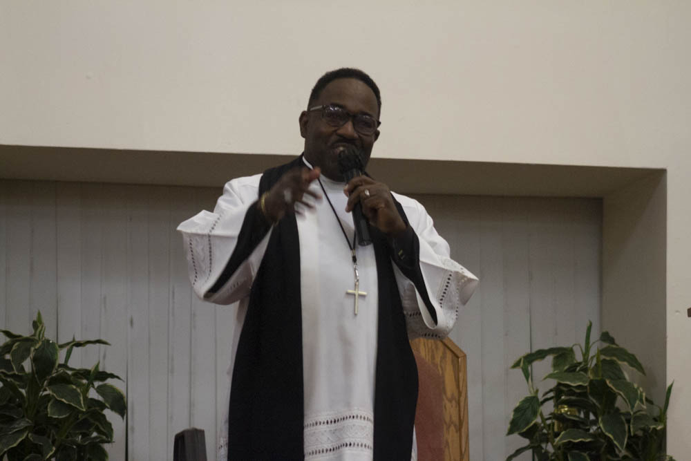 Pastor John A. Taylor preaching during an in-person Sunday church service. 